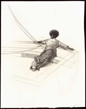 An image of a seated male facing the viewer.