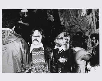 Roberta and man with eyes blacked out.