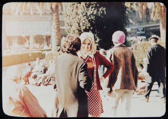 photograph of Roberta meeting someone on the street.