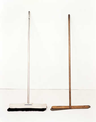 Wooden broom with silver casing, and copper broom handle and head, with felt underlay.  Both...