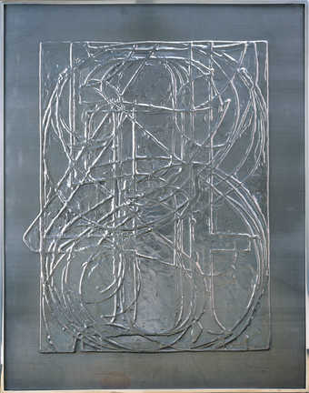 An image of the numbers 0-9 printed one on top of another embossed from one relief block in lead.