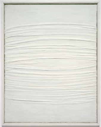 A canvas creased and covered with kaolin