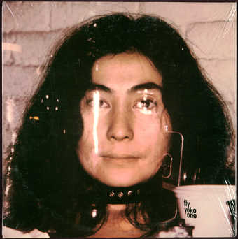 Unopened L.P. record sealed in plastic wrap. Inner jacket designed by George Maciunas.