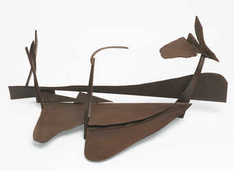 An oxidized steel construction, composed of welded steel plates.