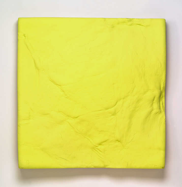 A sculpted piece of burlap covered polyurethane painted day-glo green.