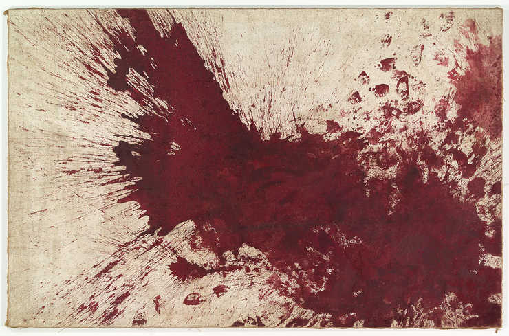 A red paint splash and footprints on canvas