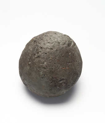 gray ball of plasticine with debris from being rolled on the ground; approximately 200 lbs.;...