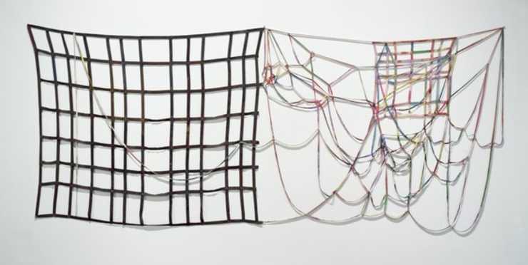 thin strips of multicolored canvas sewn together into a tangle.  No support.