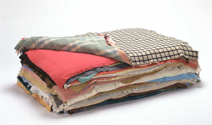 blankets stacked to form a bed