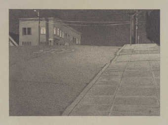 A street scene at night.