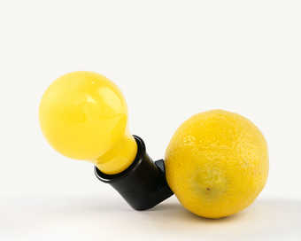 Yellow light bulb and card, inside wooden box