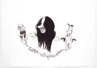 An image of a smiling man with shoulder length hair, who holds an end of a string in each hand...