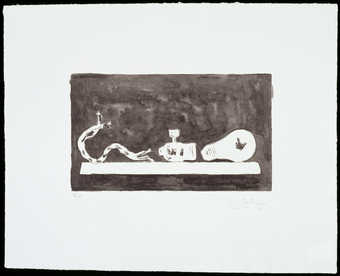 A light bulb on a table with light socket, and cord