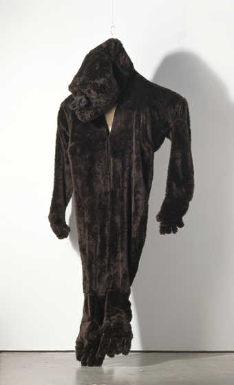 gorilla suit which hangs so that its heels are flat on the ground; this was used in...