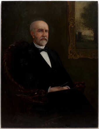 Naturalistic portrait of T.B. Walker sitting posed in a chair, which has bird motif arms, in...