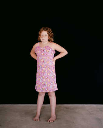 A portrait of 2 girls and a boy.