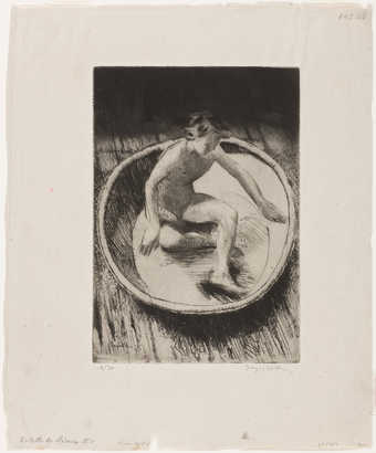 an image of a young girl bathing in a wash tub.