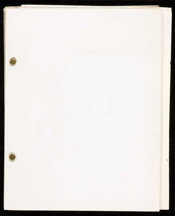 A  paperback booklet with pages held together by fasteners.  The text is in French.